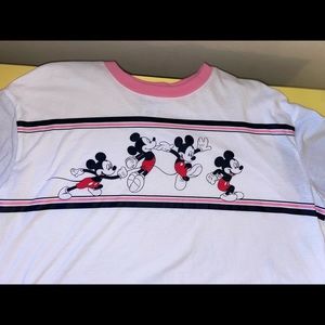 It is a white, pink, and black top. Size is XL (15-17). Disney.